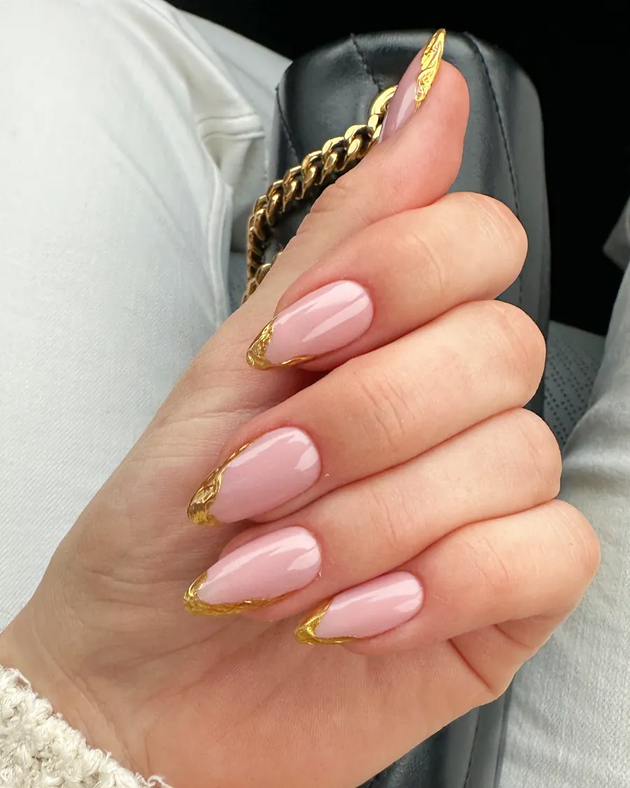 Pink almond press on nails with gold French tips