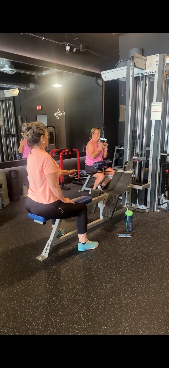 Two clients training side by side in a small group session