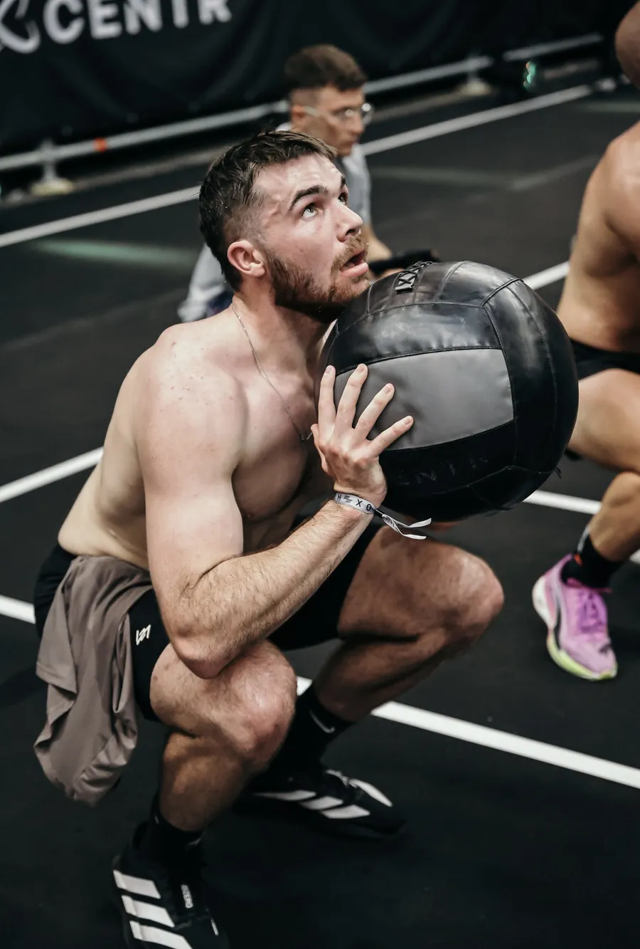 Henry Hunt mid session, holding a medicine ball