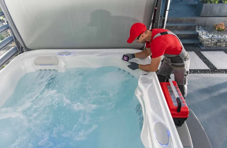 Technician servicing a hot tub spa