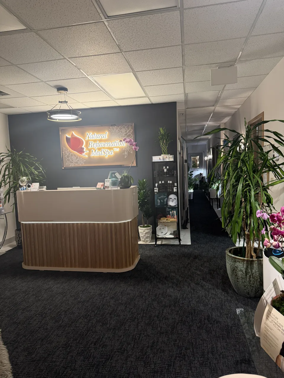 Reception desk and hallway inside Natural Rejuvenation MedSpa.