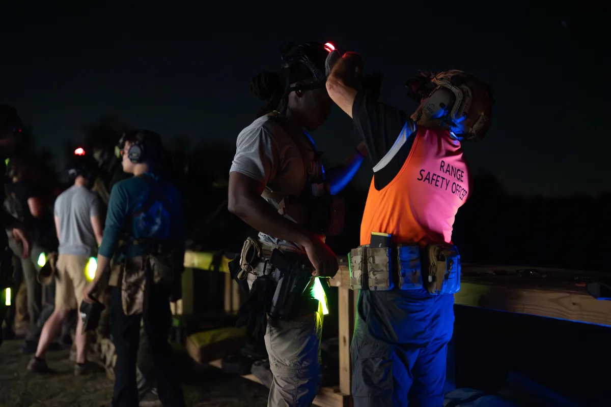 Competitors staging at dusk for the Florida Night Ruck and Shoot
