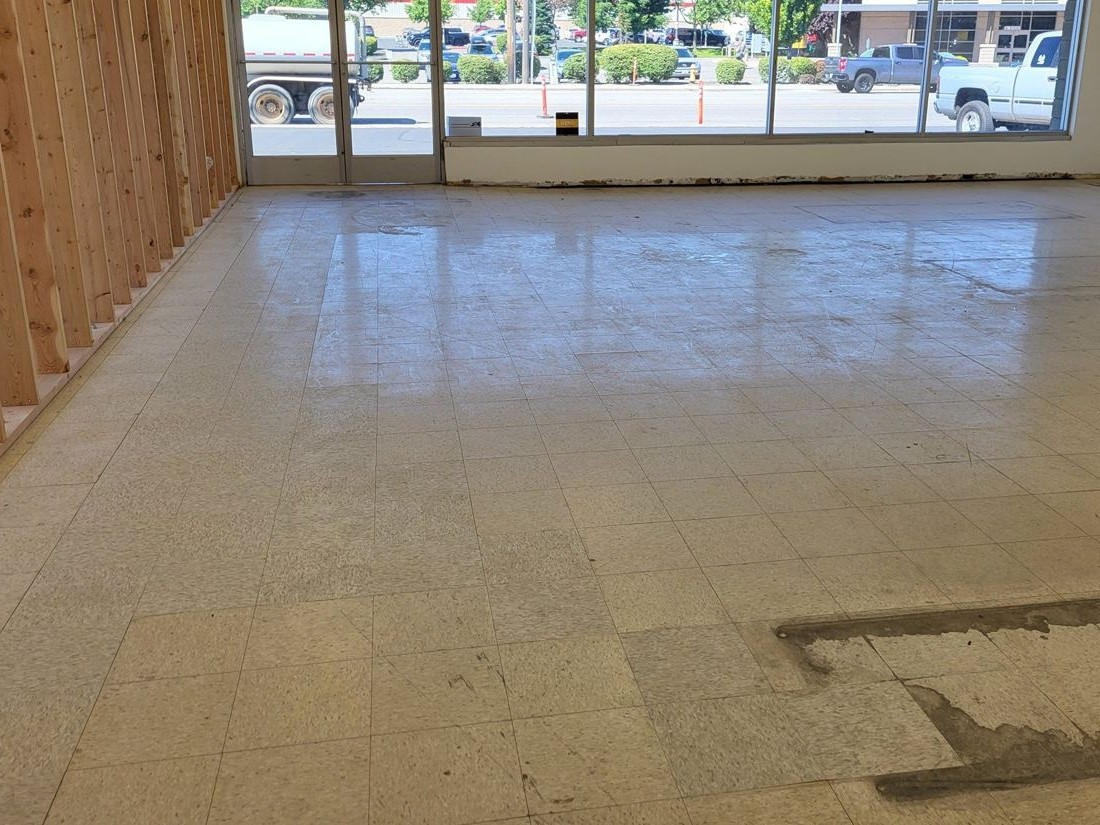 Worn commercial floor before strip and wax