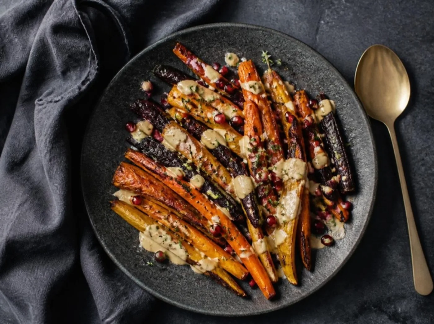 Roasted heirloom carrots with tahini and pomegranate