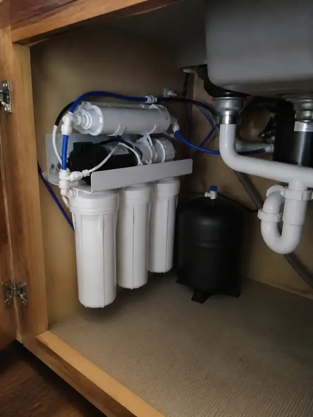 Reverse osmosis water filtration system installed under a kitchen sink in Mesa, AZ.