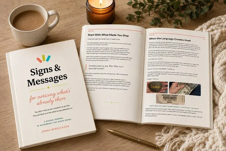 The Signs & Messages Journal open on a desk beside a cup of coffee and a pen