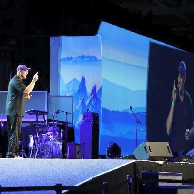 Kevin speaking on stage