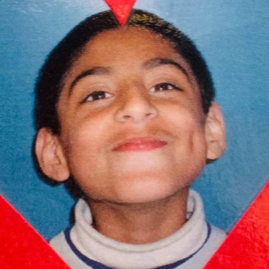 Pritinder as a young kid, smiling in a school photo