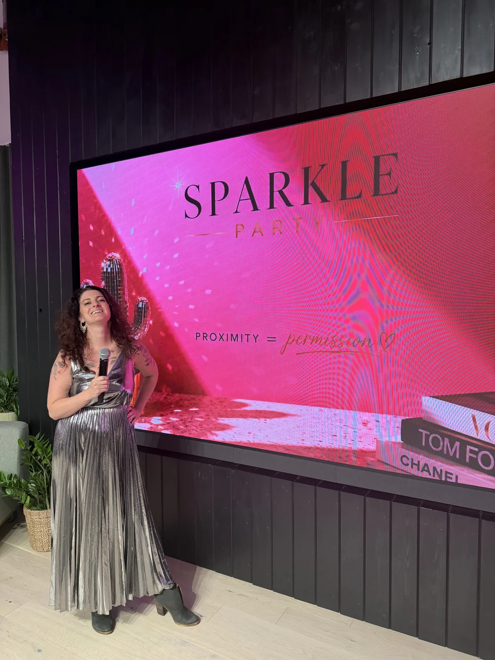 Sparkle Party speaker beside the event screen