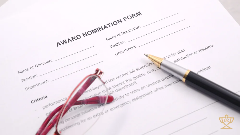 Award Nomination Form with pen and glasses sitting on top of it.