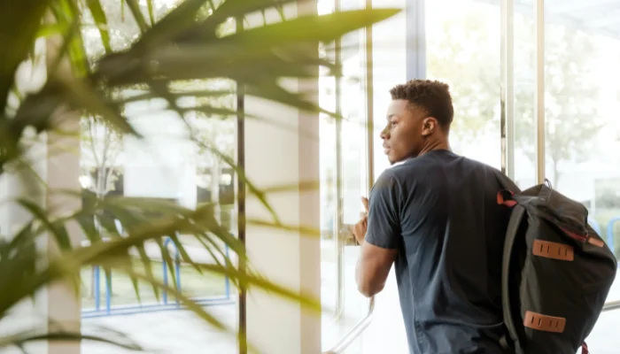 Image of a man walking out of an office