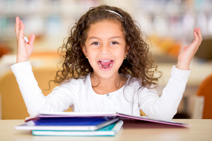 girl smiling with book