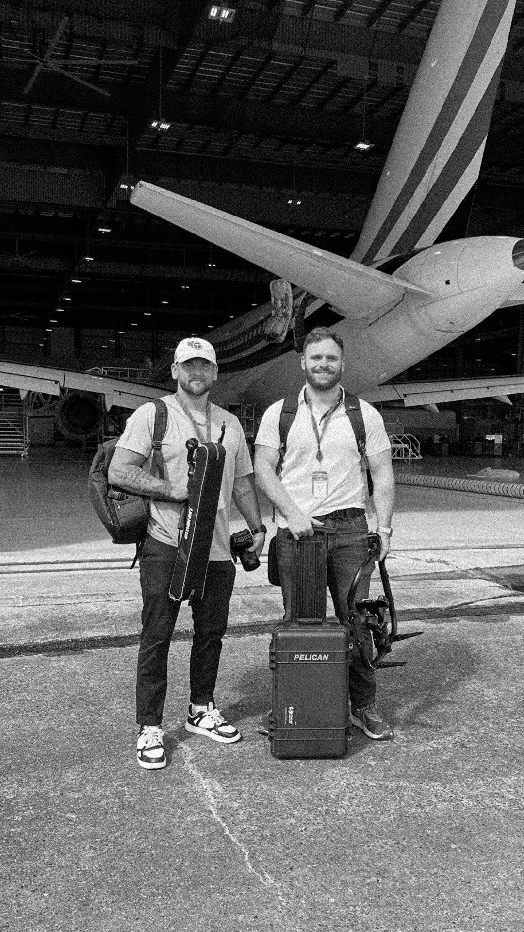 Logan and crew in an aircraft hangar