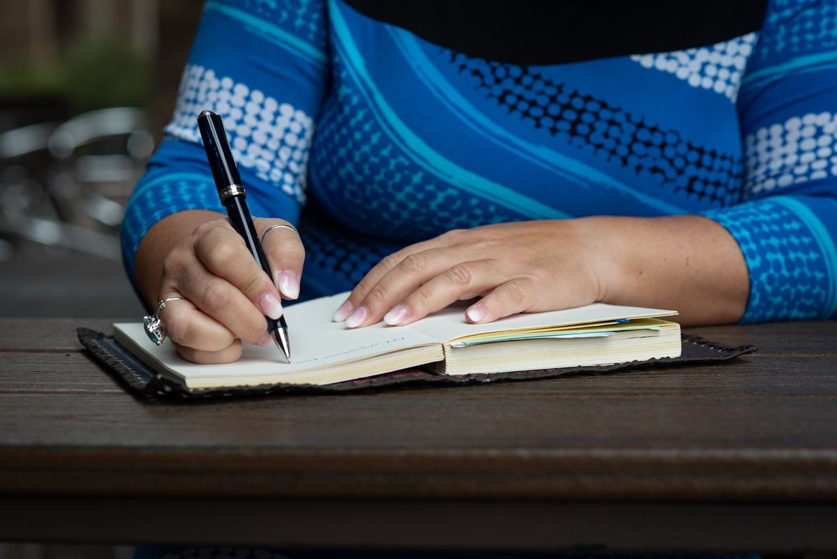 Amy writing in a journal
