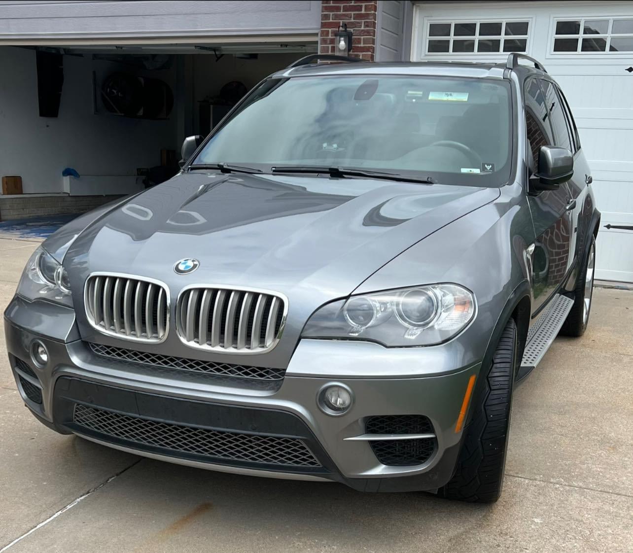 Gray BMW X5 after a full mobile detail by Invictus in Papillion NE