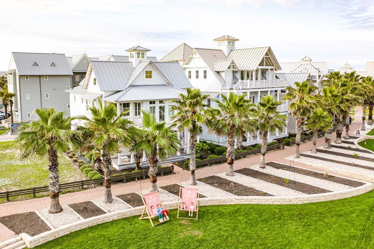 Palm-lined lawn and beach cottages in a coastal community on the Texas Gulf