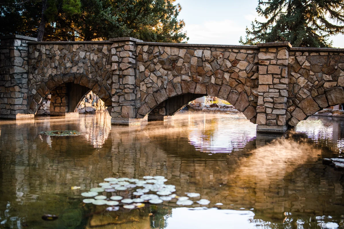 Stone bridge reflected in the pond