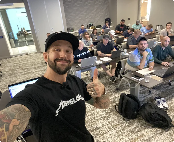 Drewbie Wilson with a room of sales professionals at a workshop