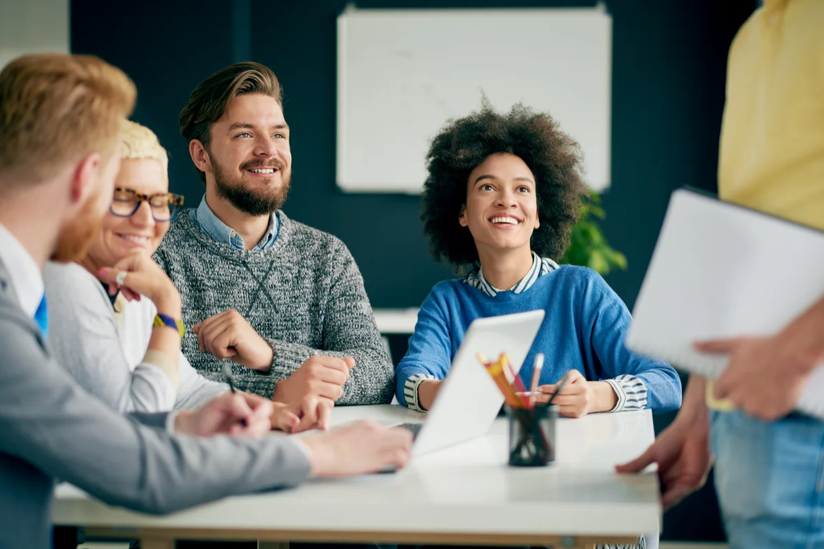  Leaders smiling together in a meeting
