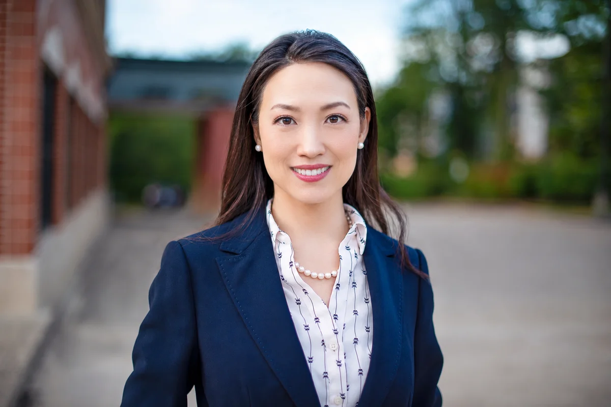 Dr. Sarai Koo in a navy blazer outdoors