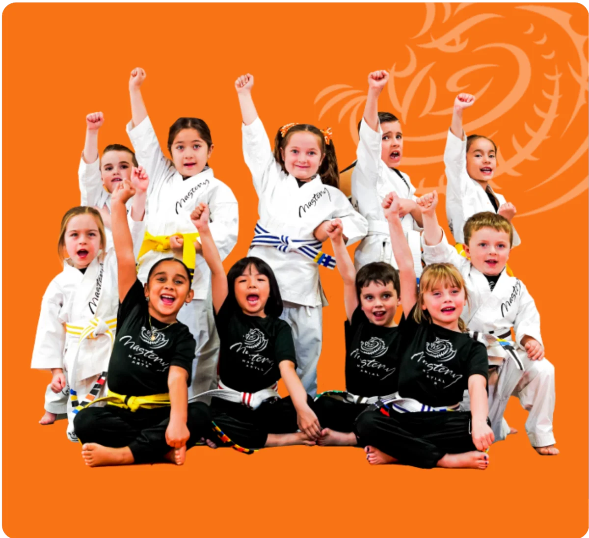 Mastery Martial Arts students cheering with their arms raised