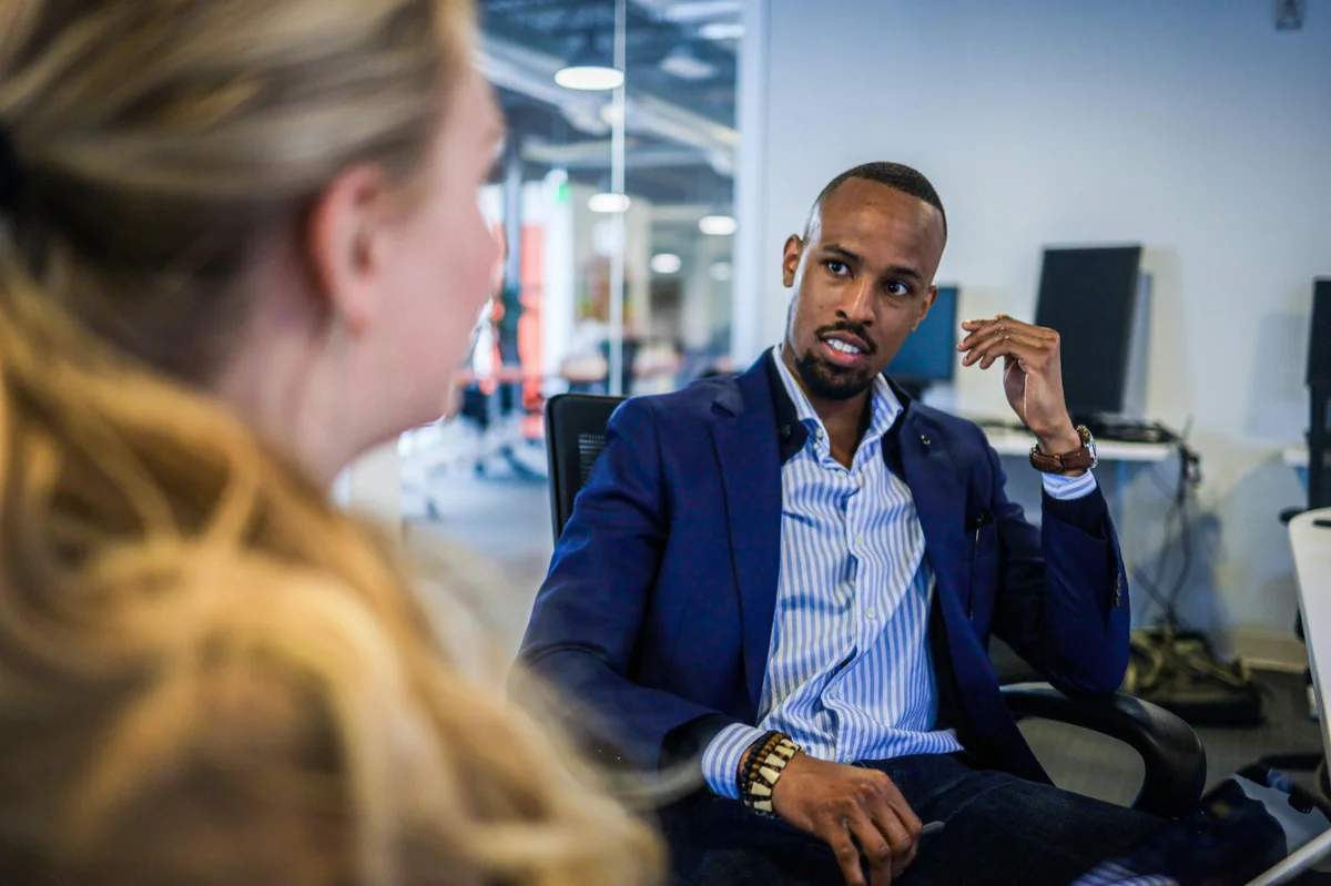 Two professionals in a one-on-one conversation