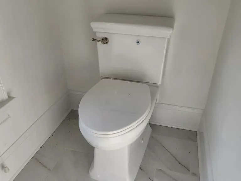 New toilet install on marble tile floor