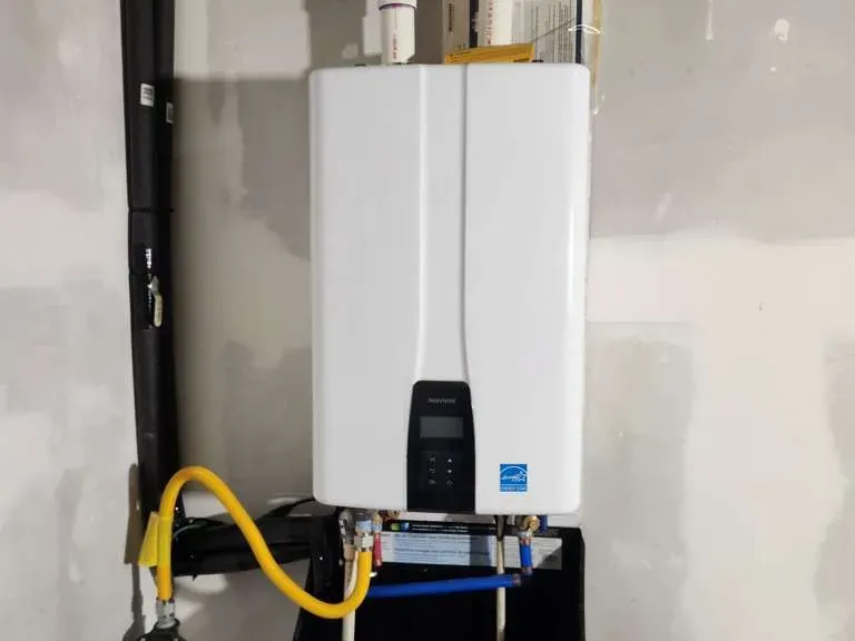Tankless water heater installed in a Charlotte garage with gas line