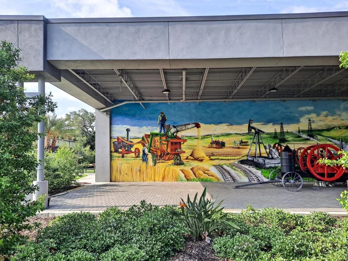 Large-scale outdoor mural depicting Florida agricultural history