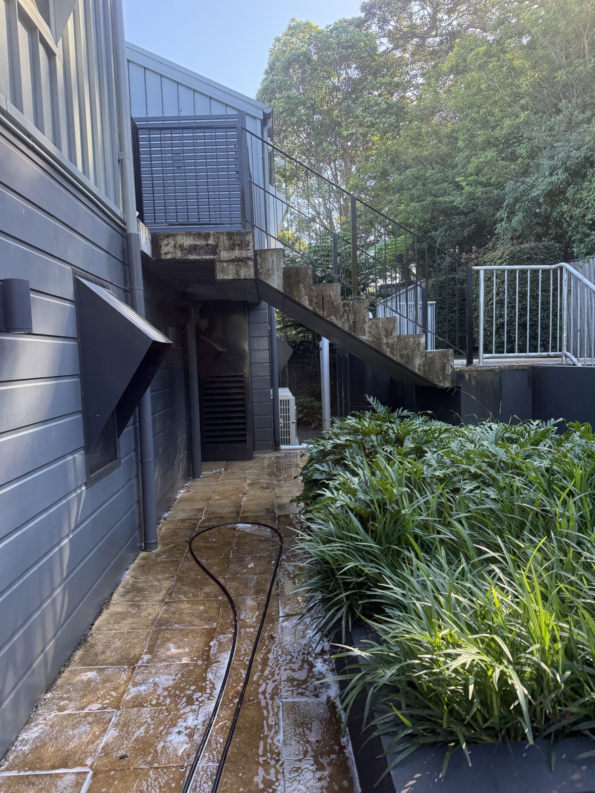 Professional pressure cleaning of an outdoor patio and entertaining area in Shellharbour NSW by ClearView Exterior Services
