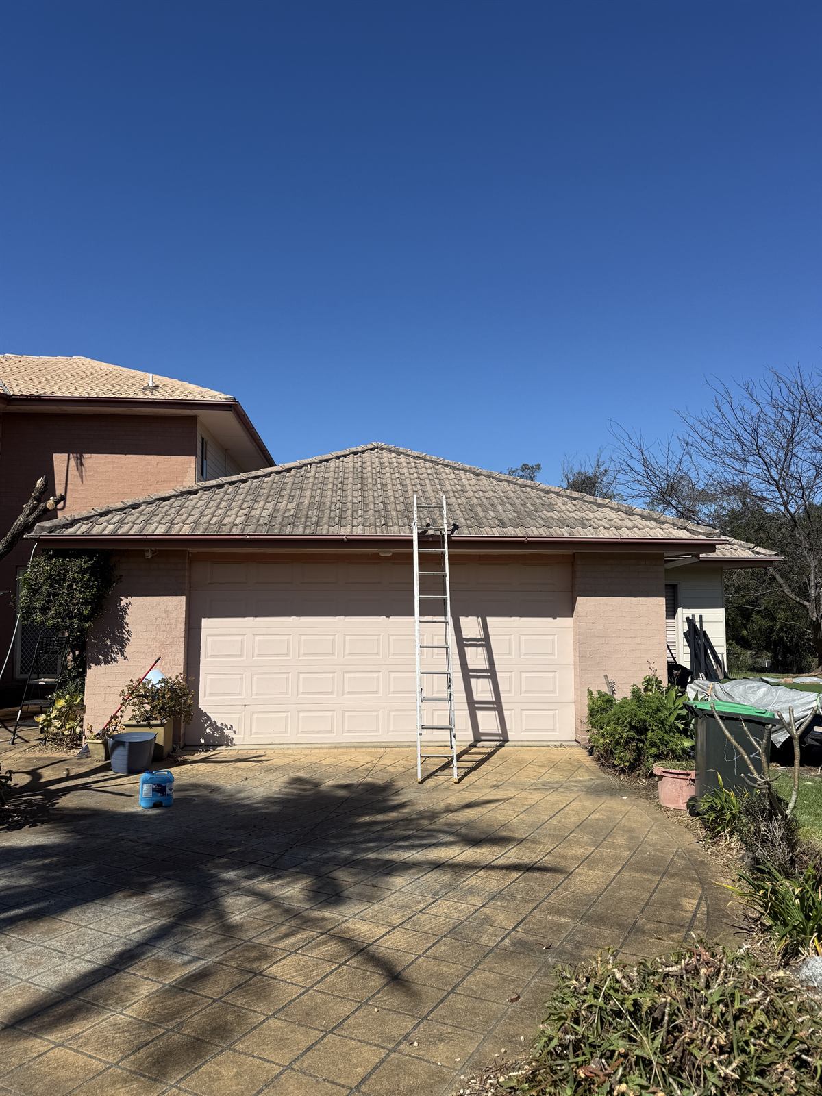 Tile roof before cleaning, front view, showing visible dirt and staining