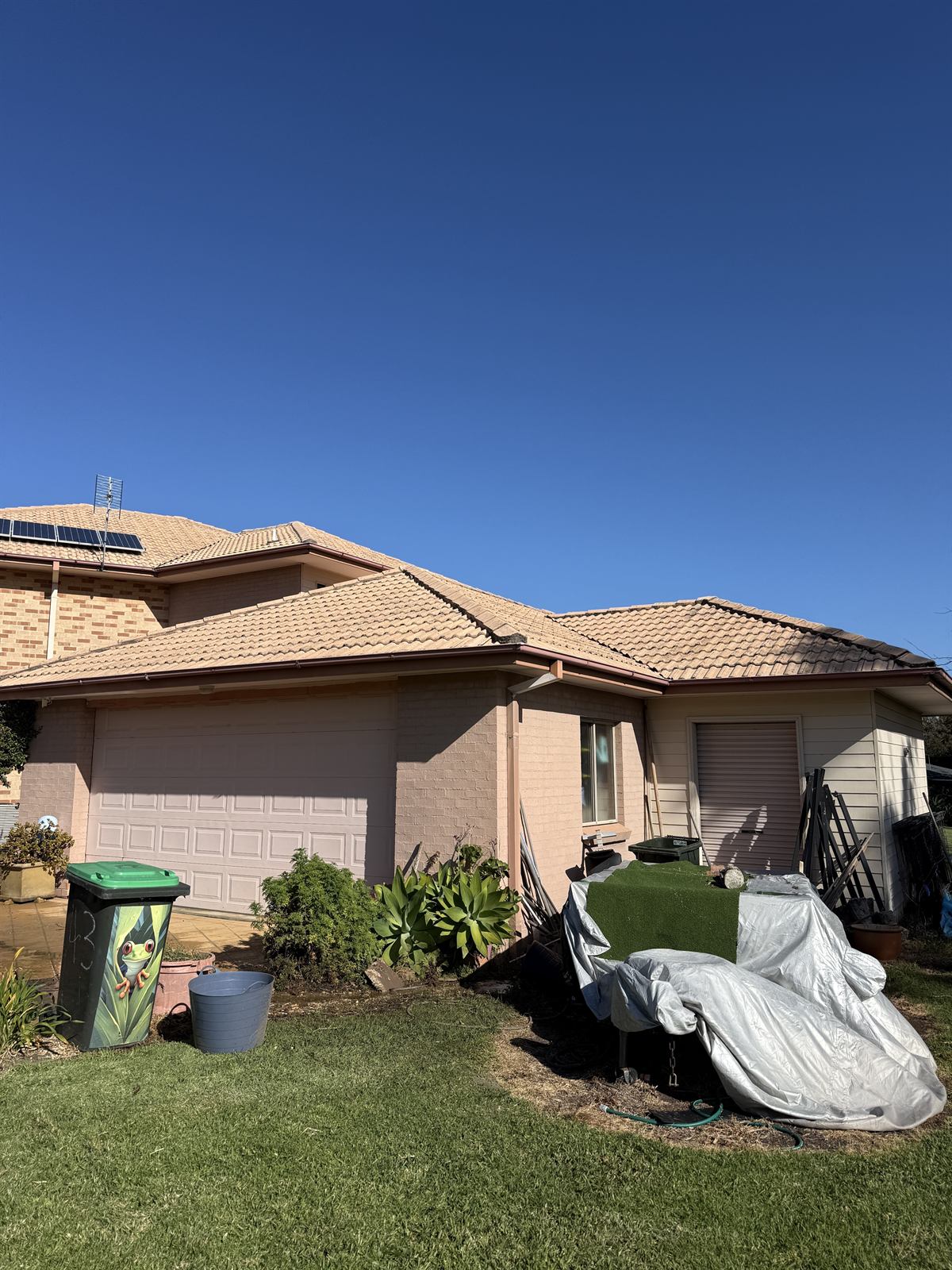 Tile roof after cleaning, side view, showing a cleaner tiled surface