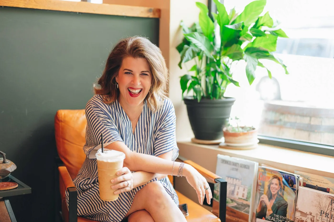 Laurel Beard laughing with an iced coffee