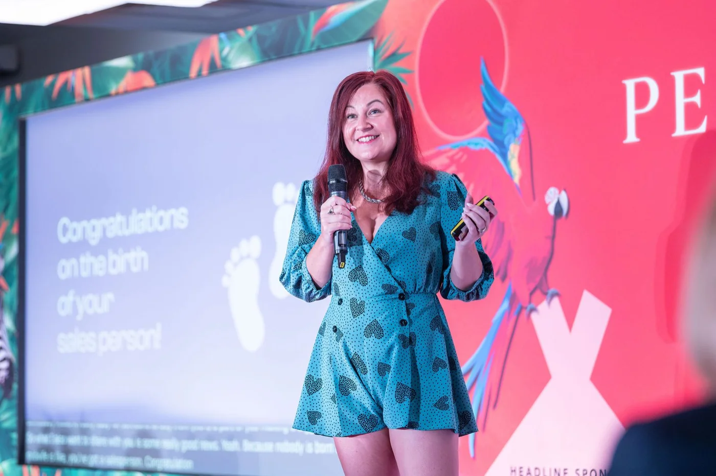 Leah Gregory speaking on stage