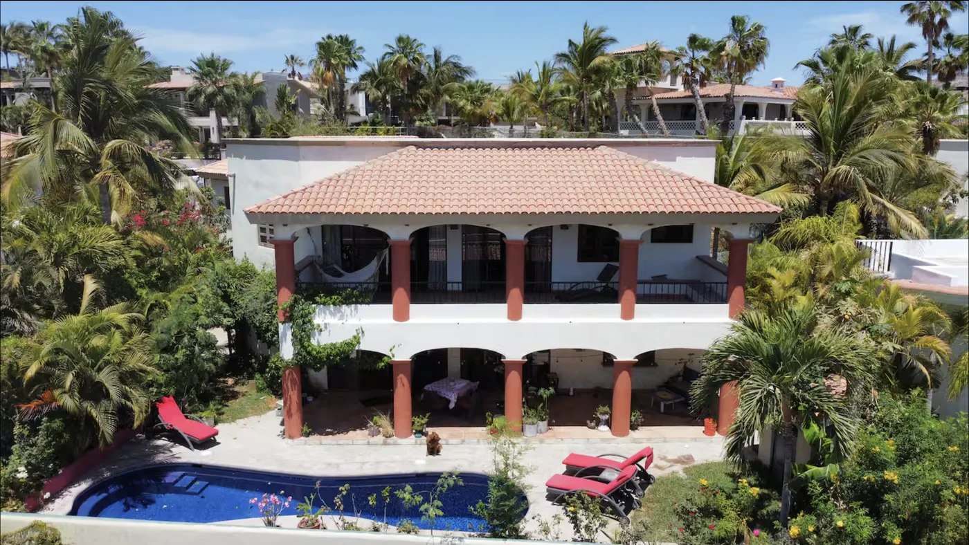 Casa Alba's arched two-story colonnade and tile roof