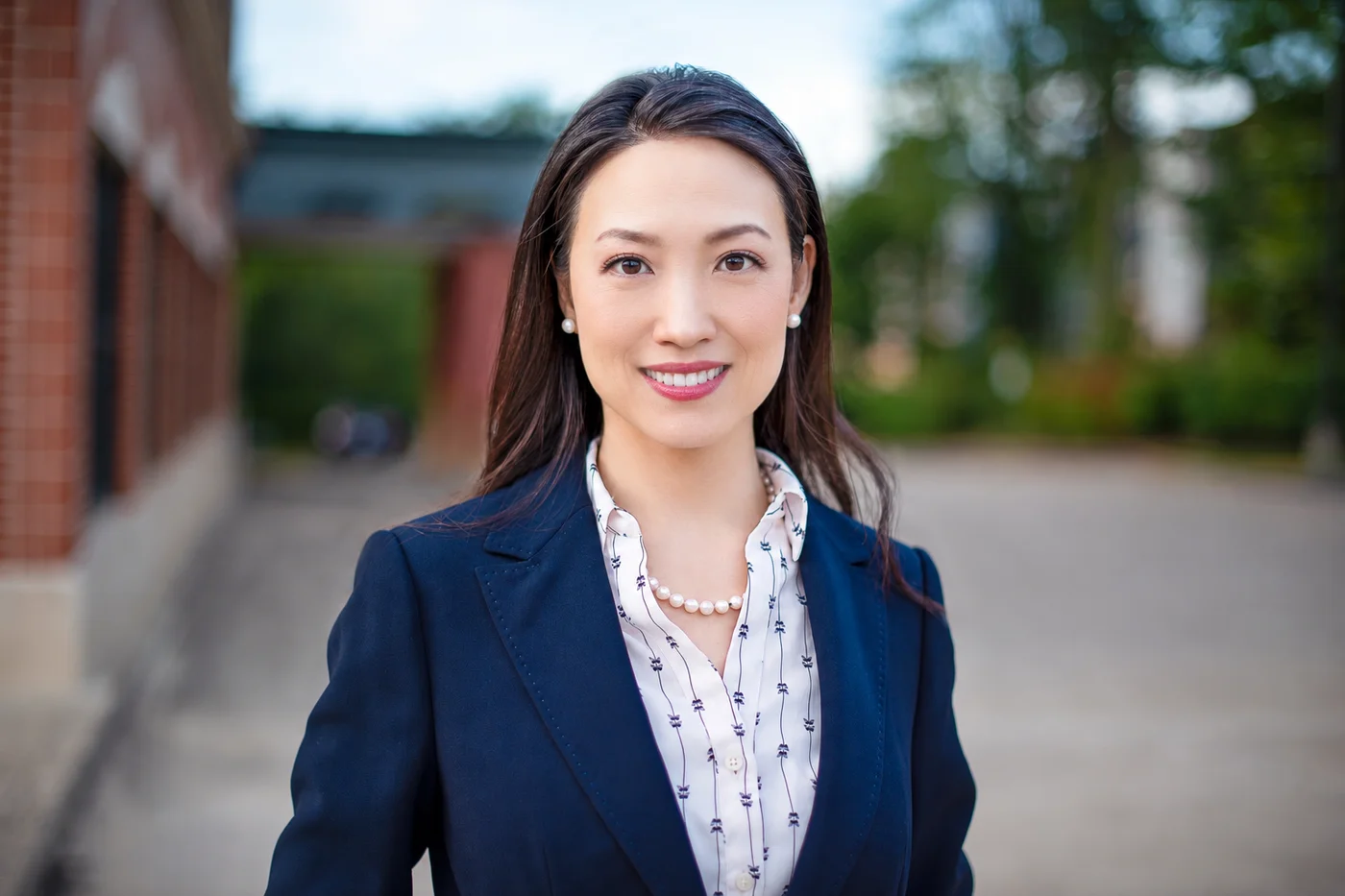 Dr. Sarai Koo outdoors in a navy blazer