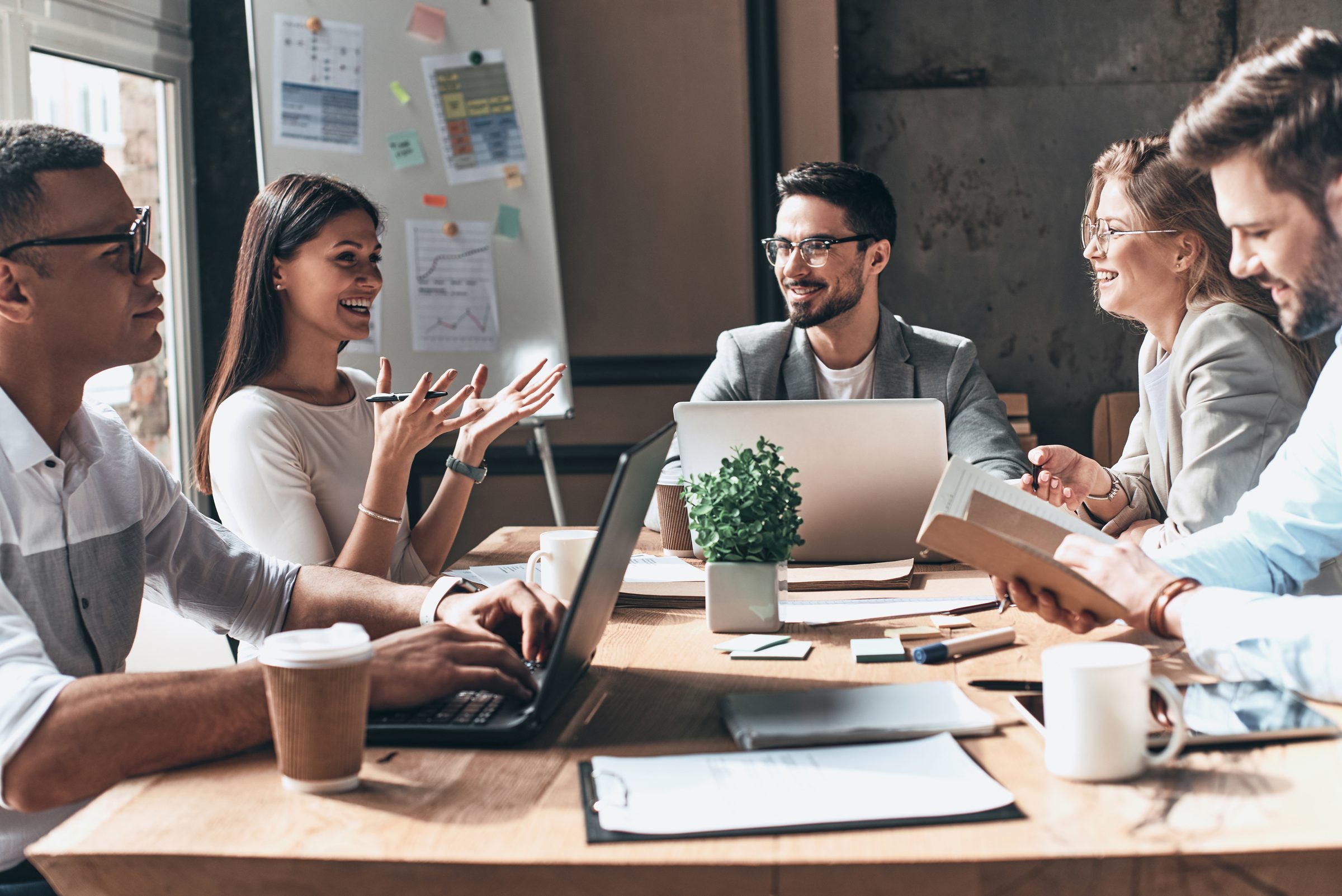 A leadership team working together around a conference table