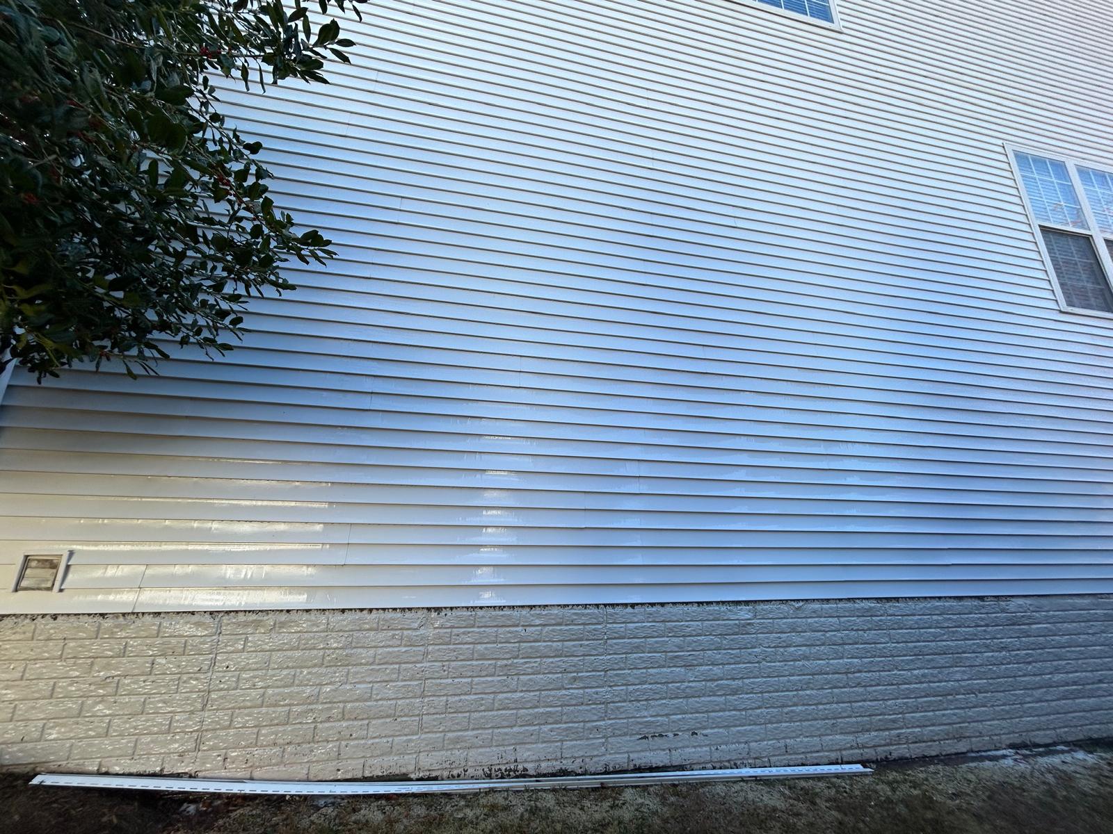 House siding before soft washing, dirty and streaked