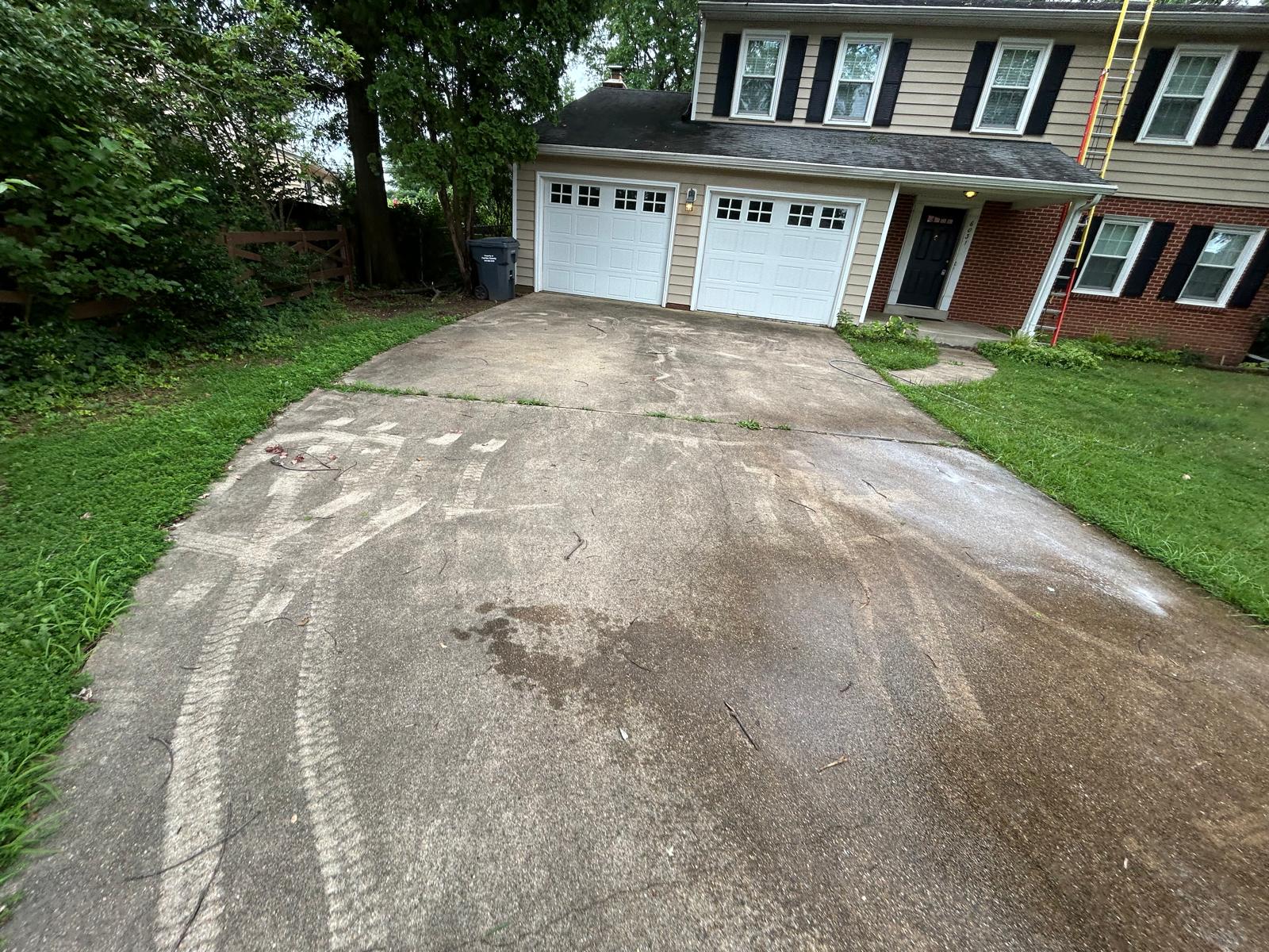 Concrete driveway before pressure washing in Northern Virginia