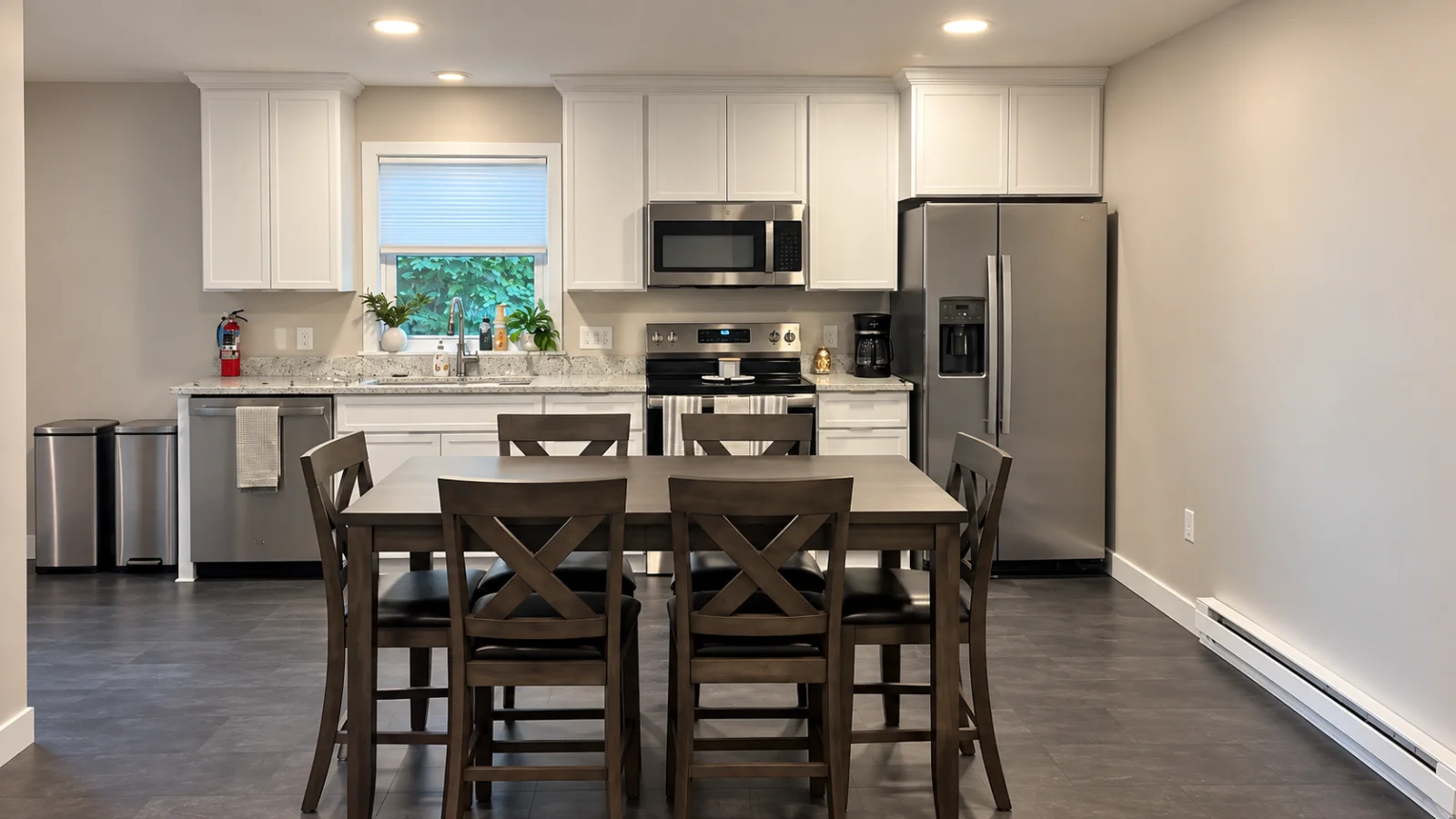 Full kitchen with a table that seats six