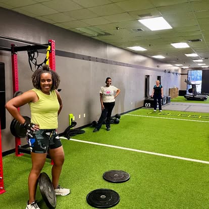 Member smiling mid-workout