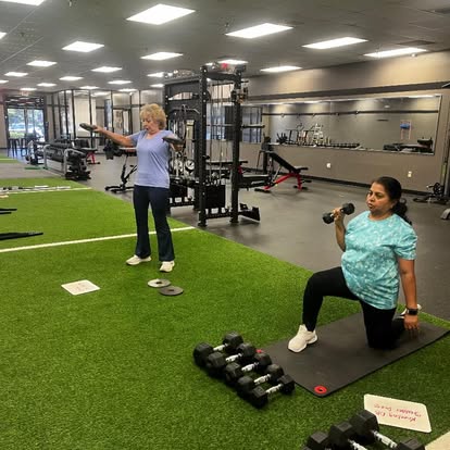 Member doing a dumbbell lunge