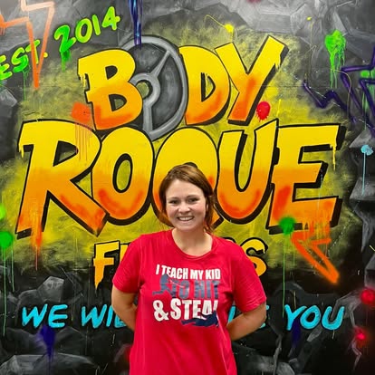 Smiling member at the Body Roque mural