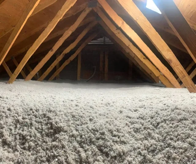Attic insulation installed between roof rafters
