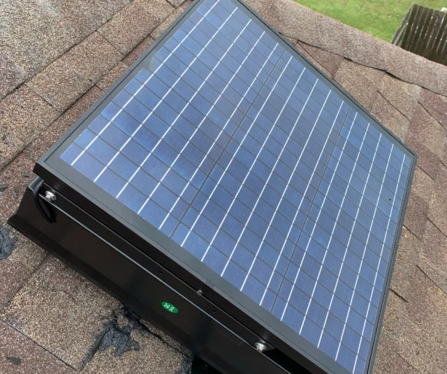 Solar powered attic fan on a roof