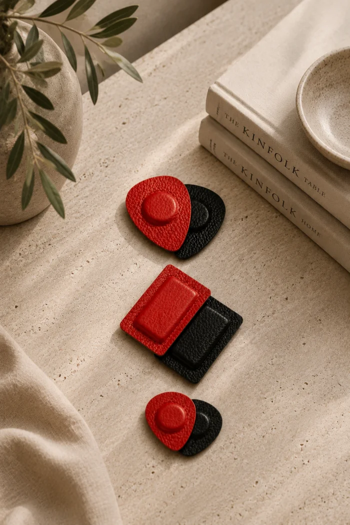 Red and black leather-cased magnet pairs
