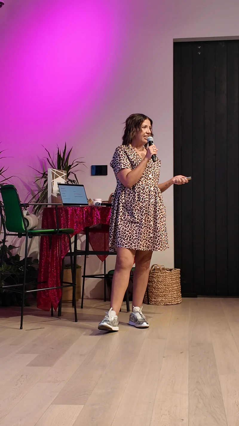 A woman speaking at a Sparkle Party event