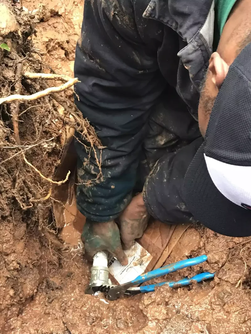 Morris Plumbing crew digging a trench for a pipe repair