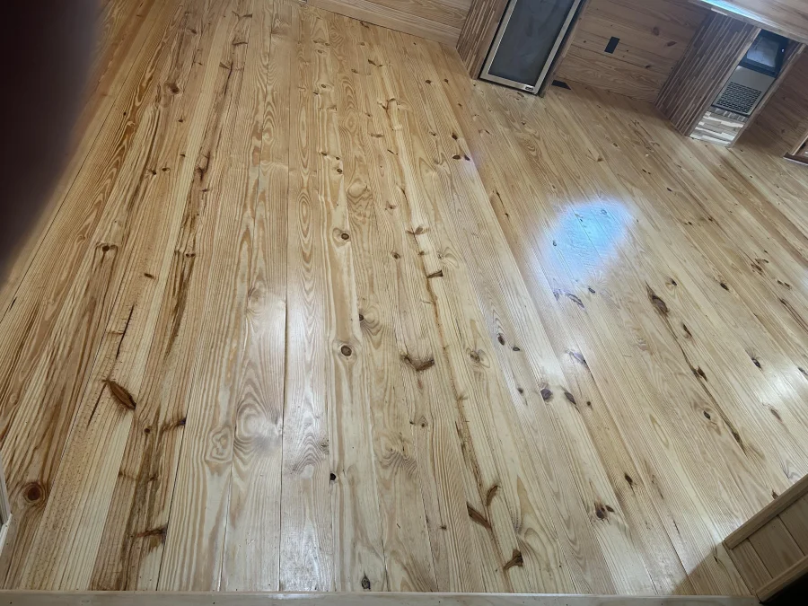New wood plank flooring installation in a Lee County home