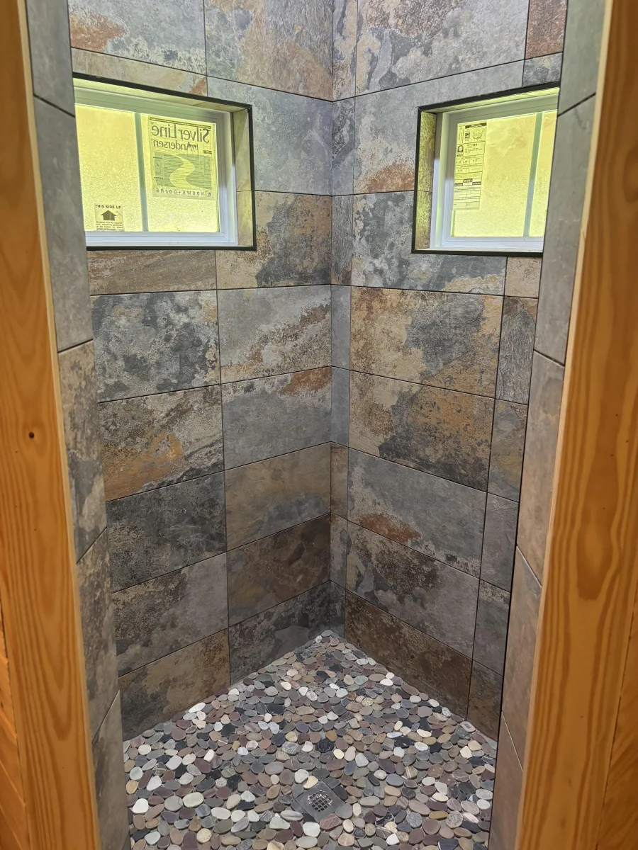 Custom stone tile walk-in shower installed by McKams Contracting